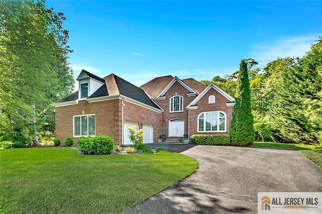 2 Danser Dr, Cranbury, NJ 08512 - view of front of home with brick siding, a front yard, driveway, and a garage