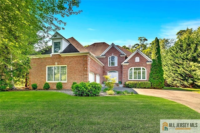 2 Danser Dr, Cranbury, NJ 08512 - traditional-style home featuring a front yard, brick siding, and concrete driveway