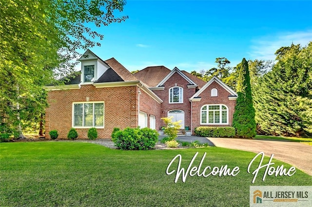 2 Danser Dr, Cranbury, NJ 08512 - view of front of property with a front lawn, brick siding, and driveway