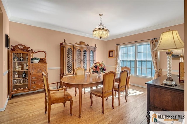 2 Danser Dr, Cranbury, NJ 08512 - dining space with light wood-style floors and crown molding