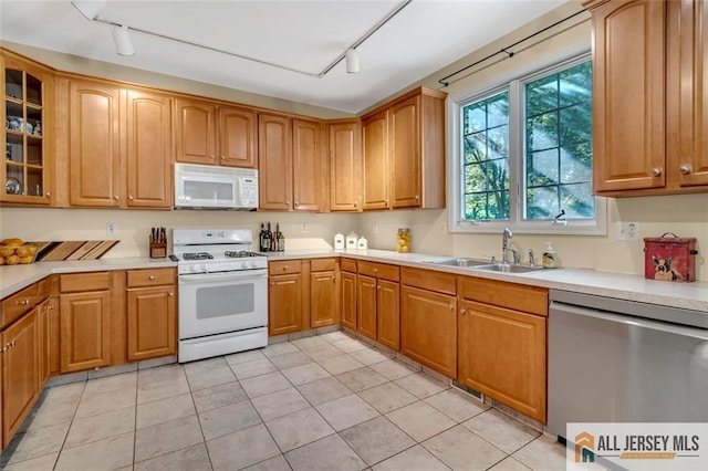 2 Danser Dr, Cranbury, NJ 08512 - kitchen featuring white appliances, rail lighting, glass insert cabinets, and light countertops