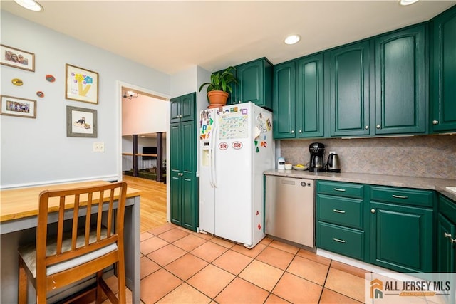 7 Hollywood St, South River, NJ 08882 - kitchen featuring white fridge with ice dispenser, stainless steel dishwasher, recessed lighting, light tile patterned floors, and decorative backsplash