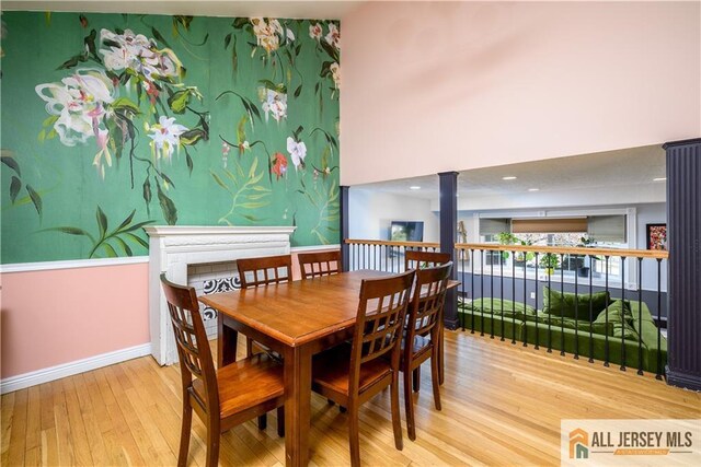 7 Hollywood St, South River, NJ 08882 - dining room featuring wood finished floors and decorative columns