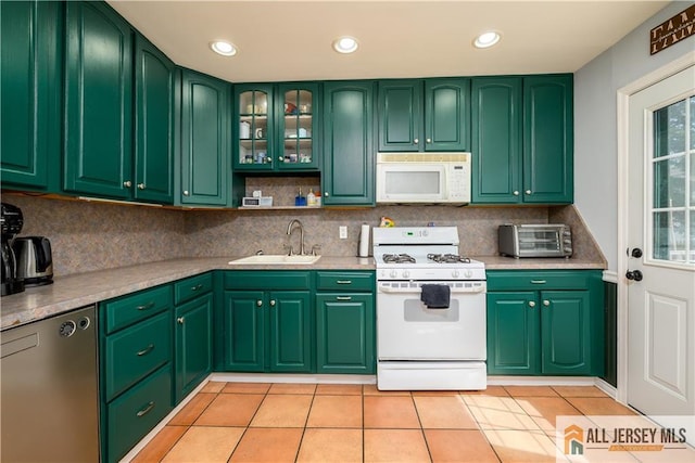7 Hollywood St, South River, NJ 08882 - kitchen with white appliances, light tile patterned floors, backsplash, light countertops, and recessed lighting