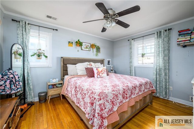 7 Hollywood St, South River, NJ 08882 - bedroom featuring wood finished floors, ornamental molding, and a ceiling fan