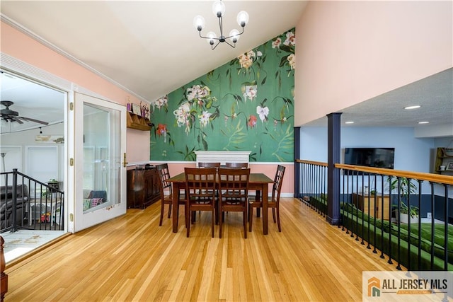7 Hollywood St, South River, NJ 08882 - dining area with ceiling fan, wood finished floors, a chandelier, and high vaulted ceiling