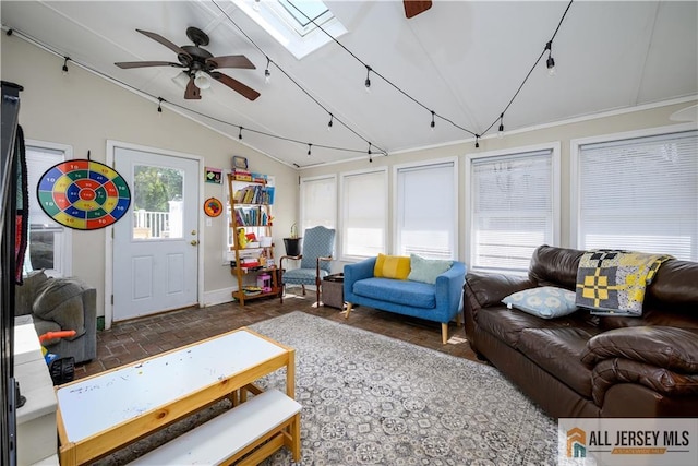 7 Hollywood St, South River, NJ 08882 - living room with vaulted ceiling, a ceiling fan, and a skylight