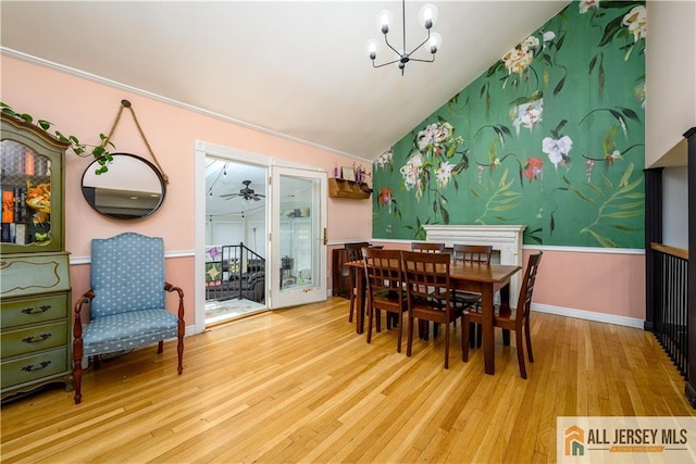 7 Hollywood St, South River, NJ 08882 - dining area with a chandelier, wood finished floors, vaulted ceiling, and a ceiling fan