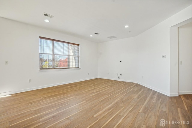 unfurnished room featuring light hardwood / wood-style floors