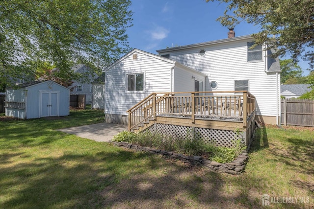 7 Winslow Ave, East Brunswick, NJ 08816 - rear view of property featuring a storage shed, a chimney, a deck, and a patio