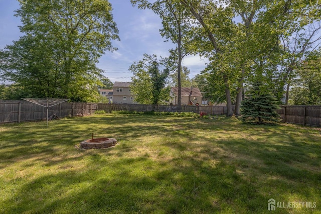7 Winslow Ave, East Brunswick, NJ 08816 - fenced backyard with a fire pit