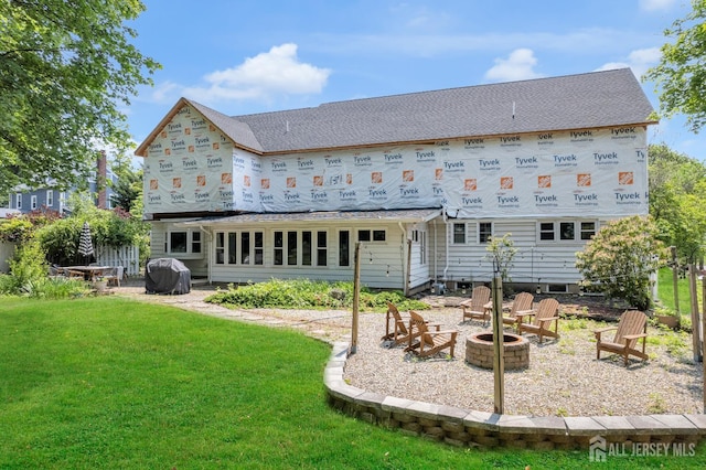 1595 Amwell Rd, Franklin Twsp, NJ 08873 - rear view of property with a fire pit and a lawn