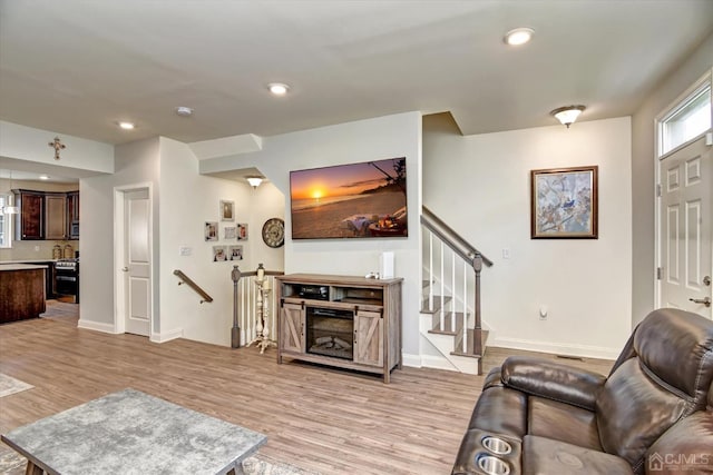 2206 Stelmaszek Rd, Sayreville, NJ 08859 - living area featuring light wood finished floors and recessed lighting