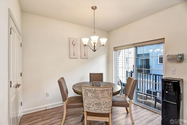 2206 Stelmaszek Rd, Sayreville, NJ 08859 - dining area featuring wood finished floors and a chandelier