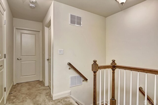 2206 Stelmaszek Rd, Sayreville, NJ 08859 - corridor with light carpet and an upstairs landing
