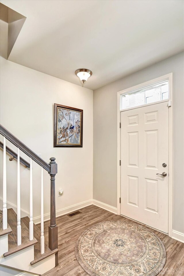 2206 Stelmaszek Rd, Sayreville, NJ 08859 - entryway featuring wood finished floors and stairs