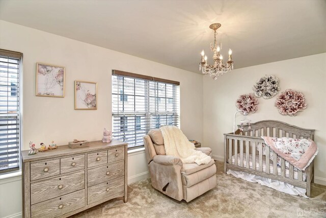 2206 Stelmaszek Rd, Sayreville, NJ 08859 - bedroom with a chandelier, light colored carpet, and a nursery area