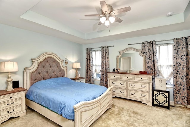 2206 Stelmaszek Rd, Sayreville, NJ 08859 - bedroom with a raised ceiling, light colored carpet, multiple windows, and a ceiling fan