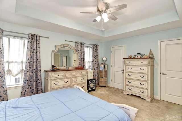2206 Stelmaszek Rd, Sayreville, NJ 08859 - bedroom featuring light colored carpet, multiple windows, and a tray ceiling