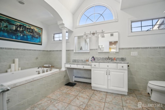 51 Greenbrook Rd, Middlesex, NJ 08846 - bathroom with a baseboard radiator, tile walls, vanity, a garden tub, and healthy amount of natural light