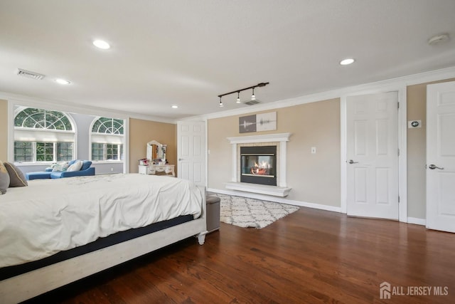 51 Greenbrook Rd, Middlesex, NJ 08846 - bedroom with ornamental molding, wood finished floors, a glass covered fireplace, recessed lighting, and rail lighting