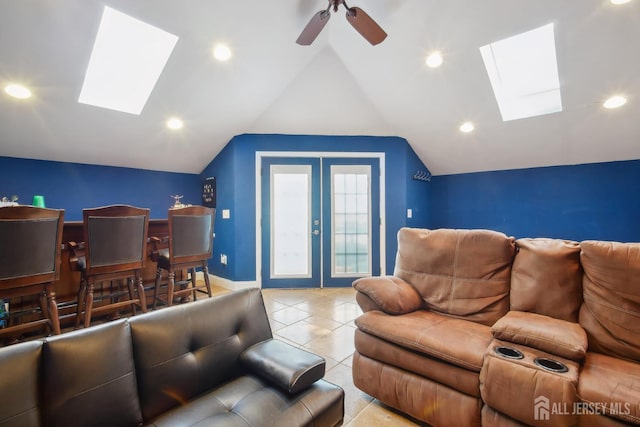 51 Greenbrook Rd, Middlesex, NJ 08846 - tiled living area with a skylight, lofted ceiling, a ceiling fan, recessed lighting, and french doors