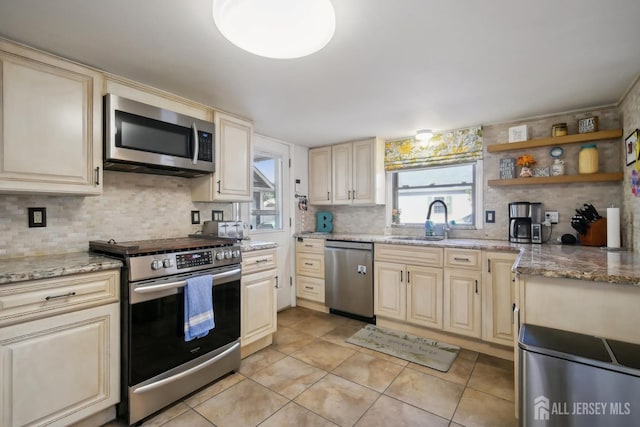 51 Greenbrook Rd, Middlesex, NJ 08846 - kitchen with stainless steel appliances, decorative backsplash, and cream cabinets