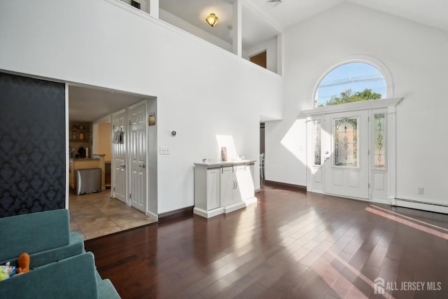 51 Greenbrook Rd, Middlesex, NJ 08846 - entryway featuring high vaulted ceiling, a baseboard heating unit, and wood finished floors