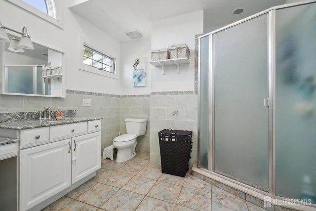 51 Greenbrook Rd, Middlesex, NJ 08846 - bathroom featuring vanity, a shower stall, tile walls, and a wainscoted wall