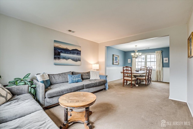 21 Stonewall Dr, Edison, NJ 08820 - living area featuring light carpet, a notable chandelier, and visible vents