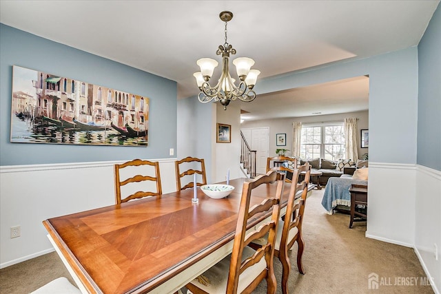 21 Stonewall Dr, Edison, NJ 08820 - carpeted dining space with an inviting chandelier and stairs