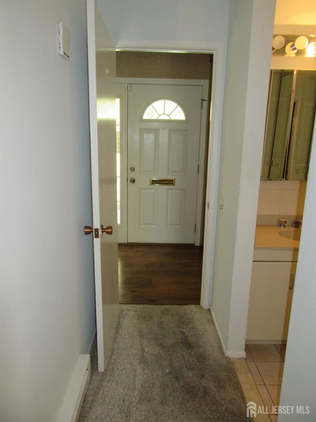 corridor featuring light carpet