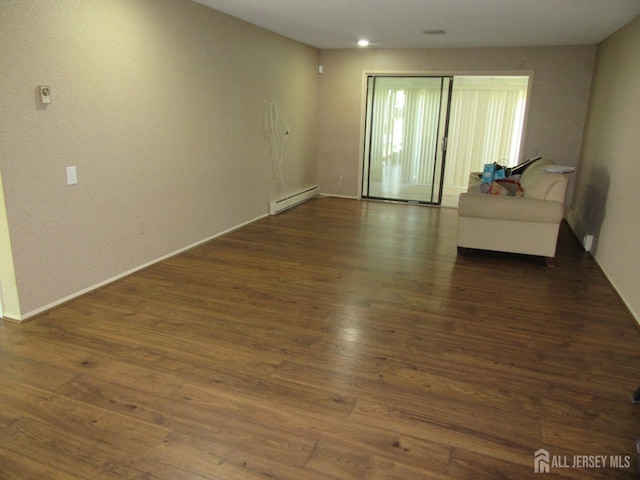 139 Cistus Plz Unit A, Monroe, NJ 08831 - unfurnished living room with a baseboard radiator, wood finished floors, and baseboards