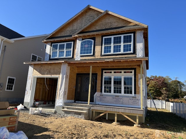 310 Elm St, South Amboy, NJ 08879 - unfinished property featuring fence, covered porch, and a garage
