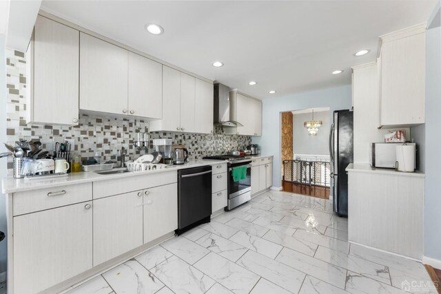 kitchen with decorative backsplash, wall chimney exhaust hood, stainless steel appliances, sink, and white cabinets