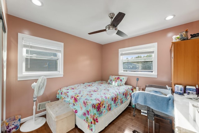 bedroom featuring ceiling fan and dark hardwood / wood-style floors