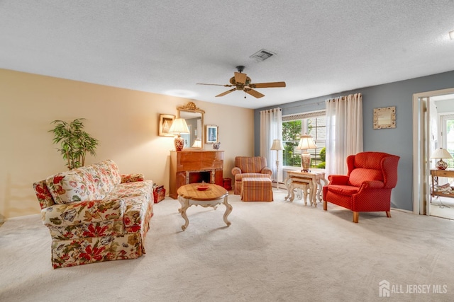 152 Chatham Dr Unit A, Monroe, NJ 08831 - carpeted living area with ceiling fan, a brick fireplace, and a textured ceiling