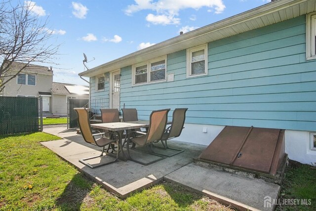 back of house featuring a patio area and fence
