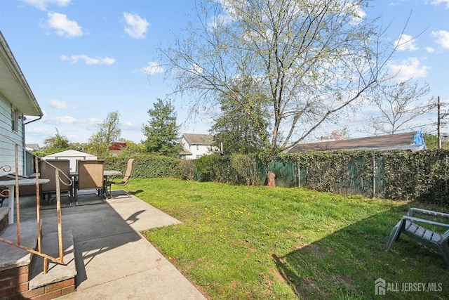 114 Woodrow Ave, Piscataway, NJ 08854 - view of grassy yard with a patio and outdoor dining area