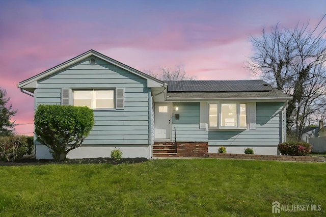 114 Woodrow Ave, Piscataway, NJ 08854 - ranch-style home featuring a yard and roof mounted solar panels
