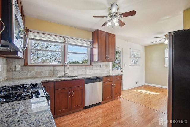 114 Woodrow Ave, Piscataway, NJ 08854 - kitchen featuring stainless steel appliances, ceiling fan, light wood-style flooring, tasteful backsplash, and light stone counters