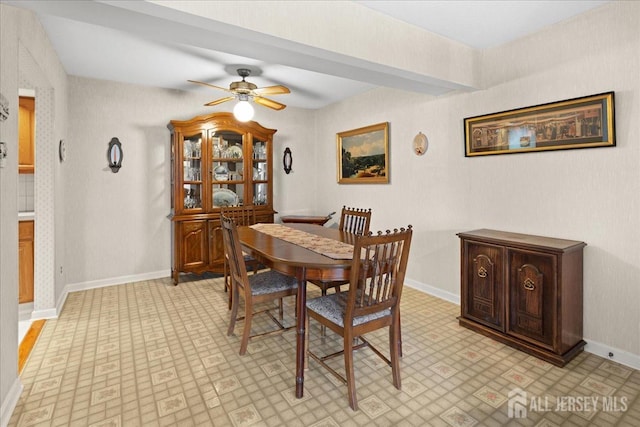 dining space with light floors, a ceiling fan, and baseboards