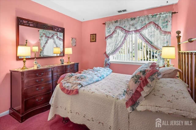 carpeted bedroom with visible vents