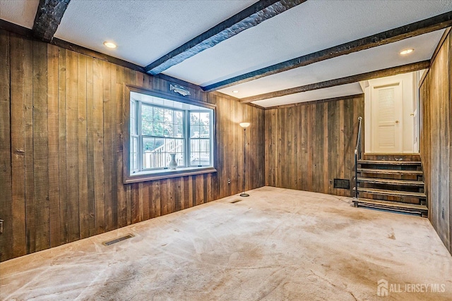 4 Bodnarik Rd, Edison, NJ 08837 - basement featuring wood walls, a textured ceiling, and carpet flooring