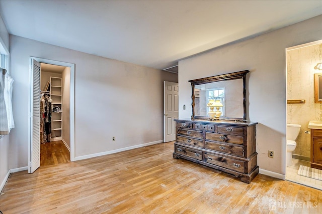 4 Bodnarik Rd, Edison, NJ 08837 - bedroom featuring light wood-type flooring, a walk in closet, a closet, and ensuite bath