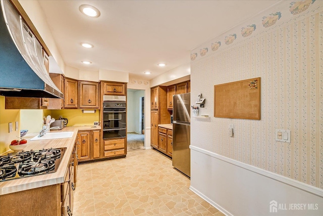 4 Bodnarik Rd, Edison, NJ 08837 - kitchen featuring oven, a warming drawer, freestanding refrigerator, ventilation hood, and brown cabinets