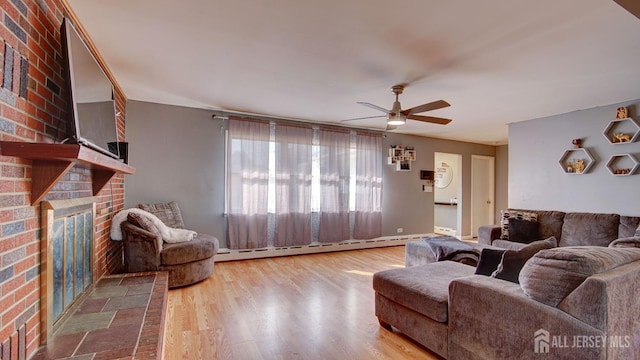 living room with hardwood / wood-style floors, ceiling fan, and baseboard heating