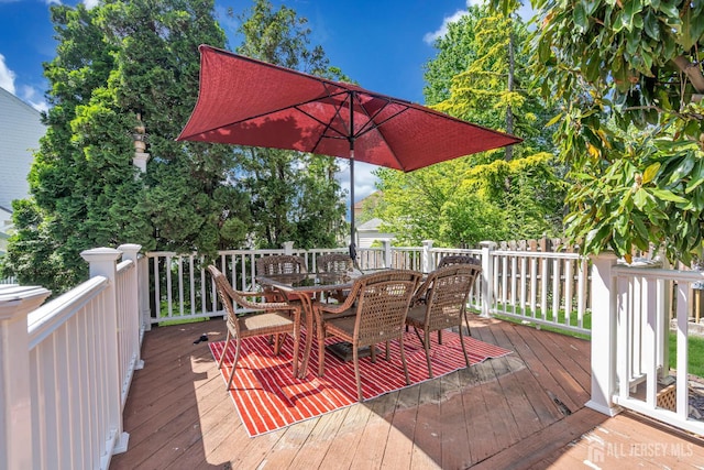 wooden deck with outdoor dining area