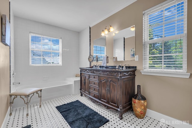 full bathroom featuring a bath, double vanity, and baseboards