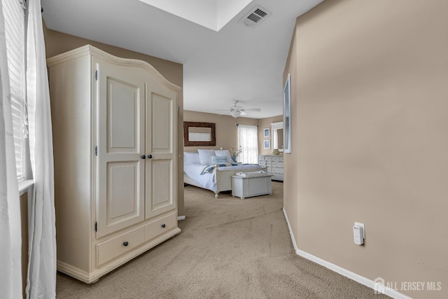 hallway with light colored carpet and baseboards